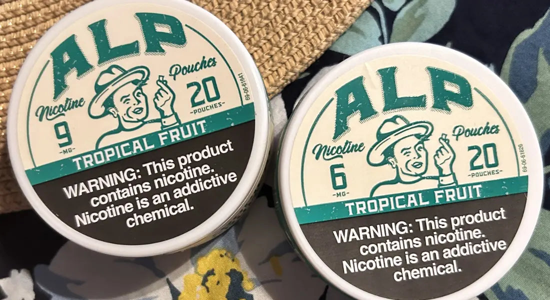 Wintergreen nicotine pouches labeled Mountain Wintergreen by ALP, shown in multiple canisters with green branding