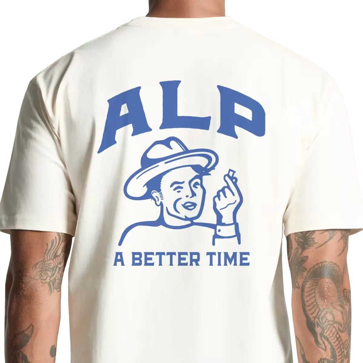 Back view of a cream-colored t-shirt featuring blue ALP logo with "A Better Time" graphic and text